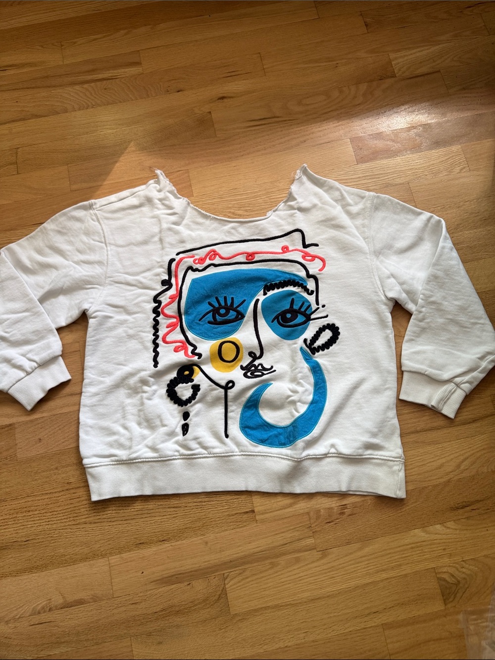 Women’s White Abstract Face Graphic Sweatshirt Raw Neckline